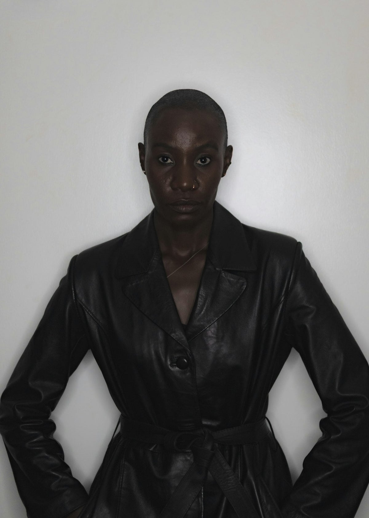 Woman wearing a long leather coat